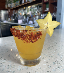 a margarita with a salt rim and starfruit garnish